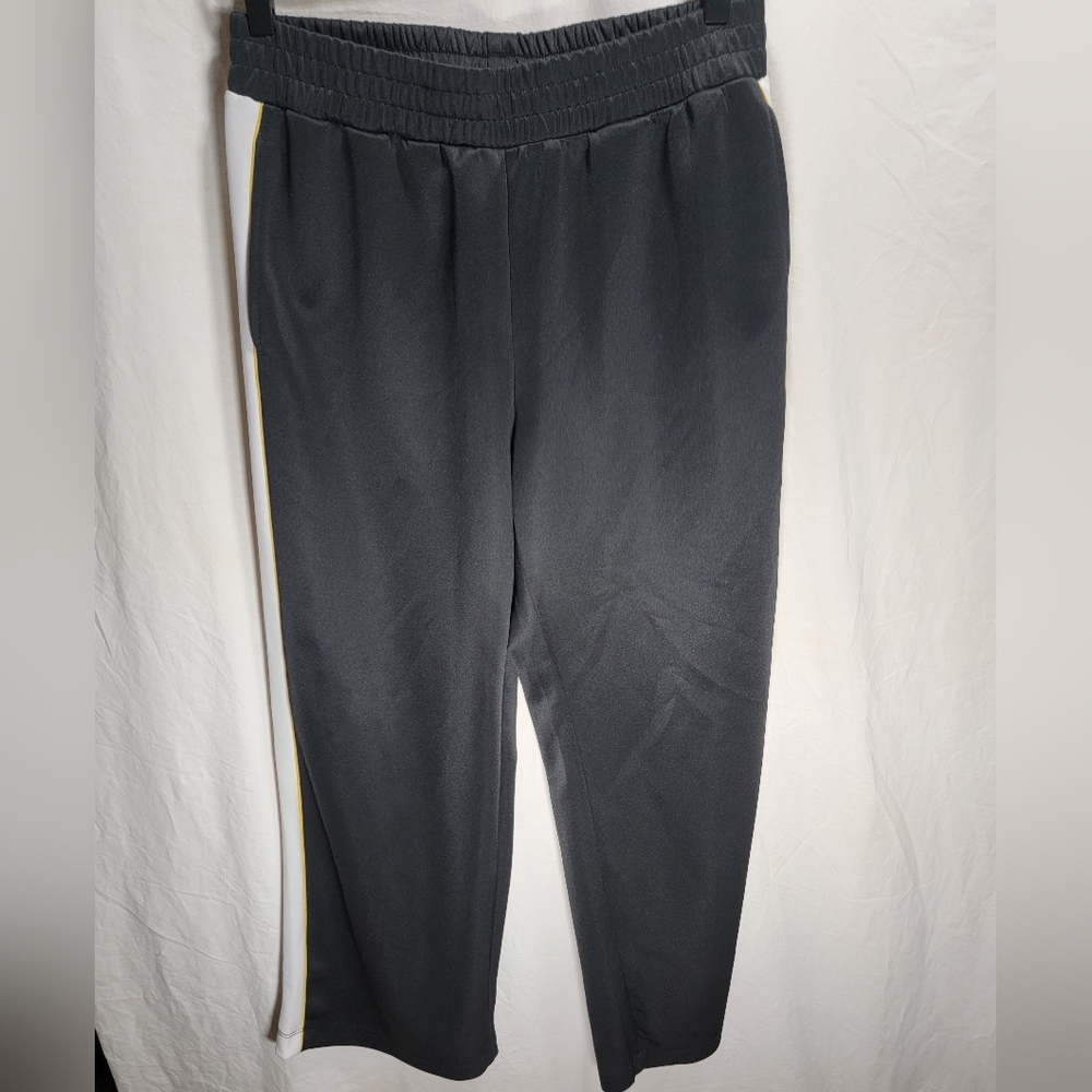 Divided medium black with white & yellow stripes joggers in great condition.
